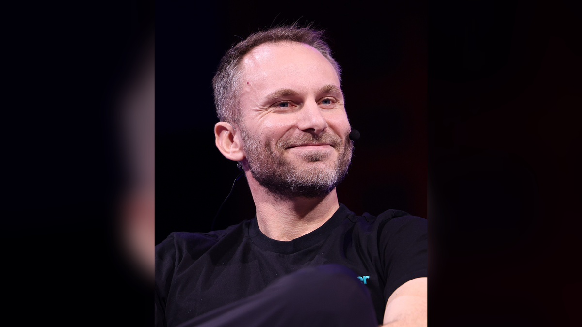 Paolo Ardoino, chief executive of Tether, speaking on stage